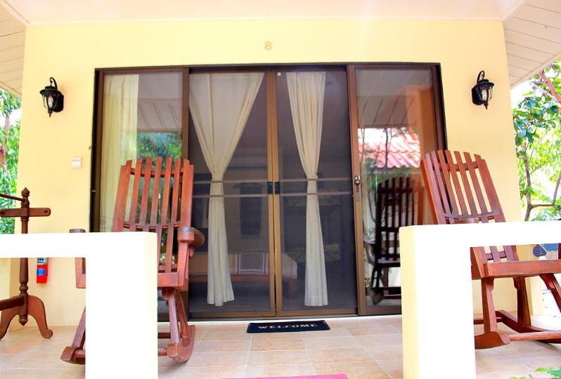 deluxe bungalow terrace with rocking teak chairs